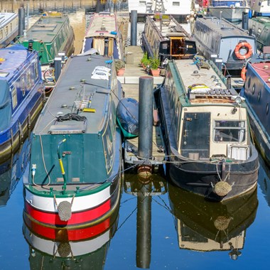 narrowboats moored in a marina canal boats